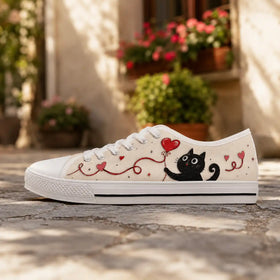 Women’s cream low tops with cheerful cat artwork