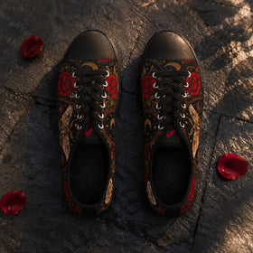 Red rose sneakers with black soles and laces