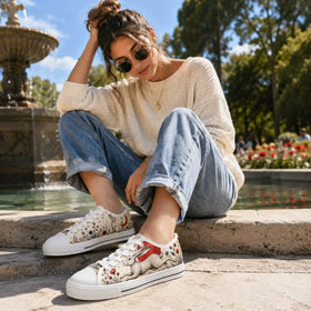 Crescent moon artwork on women’s low top sneakers